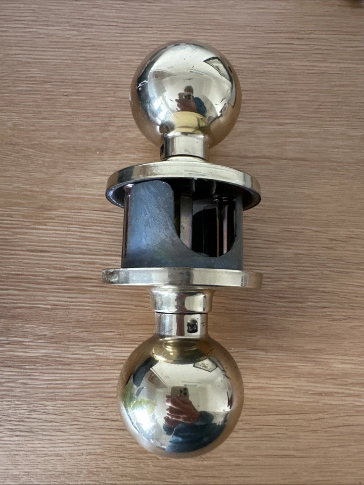 Weiser-style Door Knob, Polished Brass, Passageway - used - Image 1 of 1