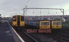 PHOTO  CLASS 314 EMU NO. 314208  OVER ON THE RIGHT ARE TWO OF THE OLDER CLASS 30