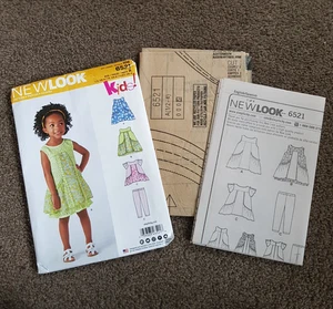 New Look 6521 Toddlers Dress Sewing Pattern Size A Ages 1/2, 1, 2, 3, 4 Uncut - Picture 1 of 4