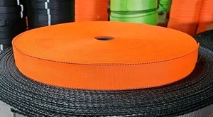 235' Roll of 1-23/32" Safety Orange w/ Black Edging Tie Down Webbing NEW! - Foto 1 di 1