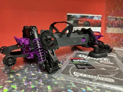 Arrma 1/10 QUAKE 223S 2WD Brushless Ready Monster Truck Roller Chassis Purple 3S - Image 1 of 4
