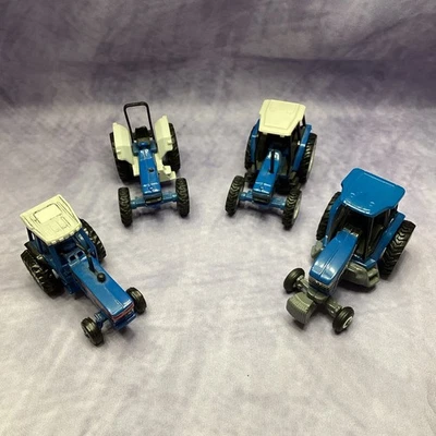 LOT OF 4 ERTL 1/64 Scale FORD New Holland TRACTORS TW35, 7840, 8870, 7740 - Image 1 of 4