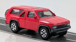 1985 Nissan Pathfinder / Red / Matchbox / 2024 - Picture 1 of 2