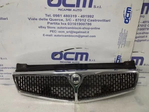 AG671000001 GRIGLIA MASCHERA MASCHERINA ANTERIORE LANCIA DELTA 1993>1996 - Foto 1 di 12