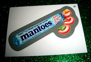 2014 Wacky Packages Series 1 "MANTOES" #37 Silver Border Sticker Card - Picture 1 of 1