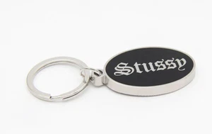 STUSSY O.E SCHLÜSSELANHÄNGER Abzeichen - Bild 1 von 2