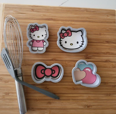 Juego de 4 cortadores de galletas temáticos de Hello Kitty.  Gatito, cabeza de gatito, arco y 3 corazones Foto 1 de 3