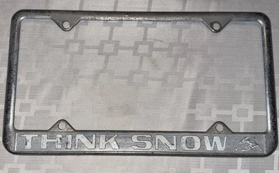 Marco de matrícula raro THINK SNOW AÑOS 70 usado ligeramente curvado con rasguños de colección Foto 1 de 4