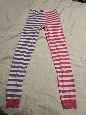 Pantalones de pijama de algodón orgánico a rayas rosa y púrpura Hanna Andersson para niñas Foto 1 de 3