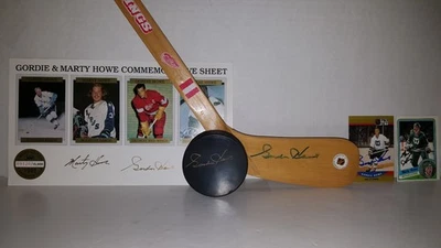 Gordie & Marty Howe Signed Detroit Red Wings Mini Stick, Puck, Cards & Photo - Image 1 of 4