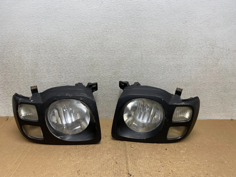 Faros laterales izquierdo+derecho Nissan Xterra 2002 2003 2004 V3215 DW Foto 1 de 4