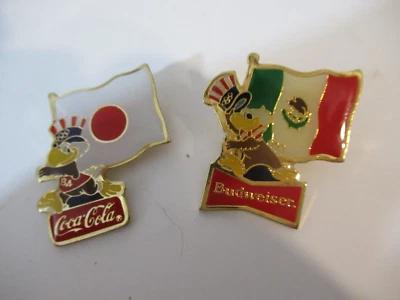 Lot of Two Sam the Eagle Olympic Flag Pins Budweiser Coke Coca Cola Japan Mexico - Image 1 of 4