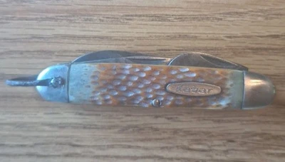 Faca de bolso vintage KABAR osso irregular 1152? Faca escoteira campista 4 funções  - Imagem 1 de 4