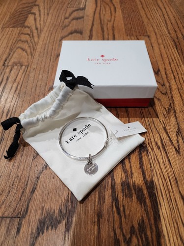 Bracciale Kate Spade argento con Charm Partner in Crime con etichette sacchetto scatola