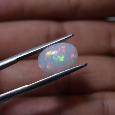 Cabujón de ópalo etíope llamativo AAA natural ovalado de 3,9 quilates 10x14 mm Foto 1 de 4