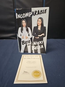 Incomparable Book - Nikki Bella and Brie Bella SIGNED COPY W/ COA WWE AUTOGRAPH - Foto 1 di 6
