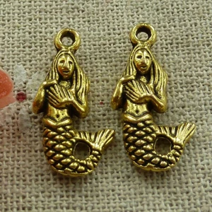 Envío gratuito 100 piezas dijes antiguos de sirena de oro 23x12mm L-1558 - Imagen 1 de 4