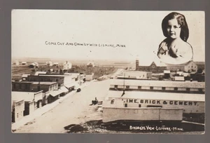 Lismore MINNESOTA RPPC 1913 MAIN STREET Exaggeration ADD ON GIRL nr Worthington - Bild 1 von 3
