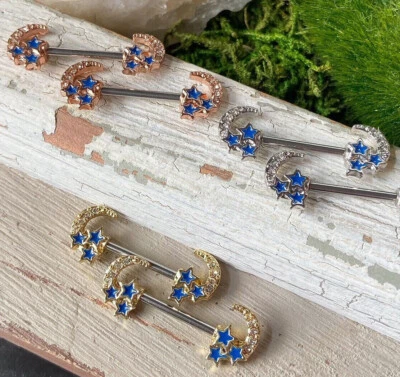 PAR DE CIRCONITAS LUNA CRECIENTE CON ESTRELLAS AZULES ANILLOS PARA PEZONES BARRAS PROTECTORAS CALIBRE 14 G 14 Foto 1 de 2