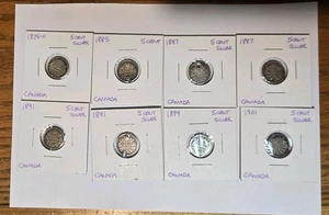 8 monete da 5 centesimi Canada in argento 92,5%, 1874-1901, tutte forate.  - Foto 1 di 9