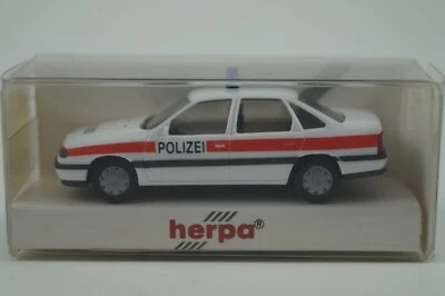 Herpa Modellauto 1:87 Opel Vectra GL Polizei Schweiz Nr. 041812 - Bild 1 von 4