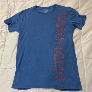 Calvin Klein, Solid Blue With Orange Letters, Size Large 14/16 - Picture 1 of 3