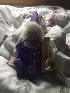 USED Hanging Porcelain Clown Doll 4 Inches on Wooden Swing. In good condition.