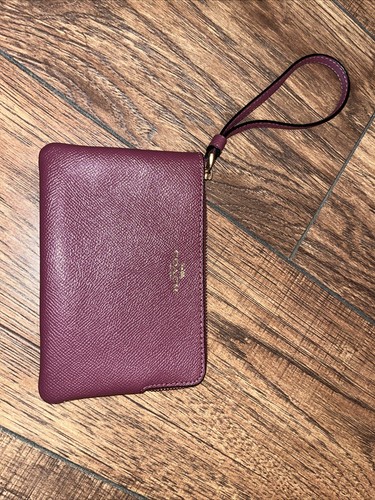 Mini bracciale Coach con zip angolare in malva