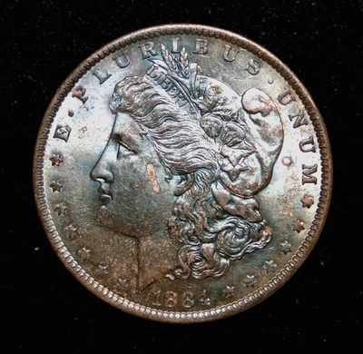 Dólar de plata Morgan 1884-O con increíbles colores obv y rev antiguo ee. uu. MONEDA TIPO Foto 1 de 2