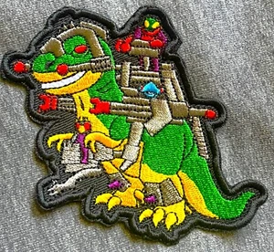 Figura logotipo bordado DINO-RIDERS T-REX parche acción dinosaurio Tyrannosaurus - Imagen 1 de 2