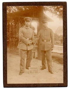 WW1 Germany ? mounted Real Photo of two soldiers with "Home Leave 1915" sign - Picture 1 of 1