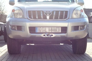 Toyota Land Cruiser J120 2002 - 2009 cabrestante placa en parachoques original - Imagen 1 de 6