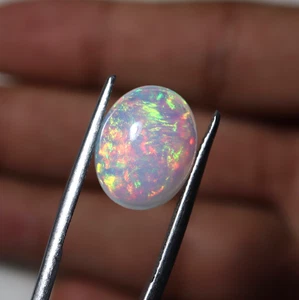 7.69 Carat Natural AAA Multi Fire Ethiopian White Opal Oval Cabs 14.9x11.9 MM - Picture 1 of 15
