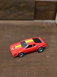 Hot Wheels BMW M-1 Real Riders 1982 auto pressofusa rossa con striscia gialla Malesia - Foto 1 di 2