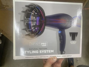 Secador de pelo con sistema de peinado de textura natural Conair INFINITIPRO 600R azul oscuro - Imagen 1 de 4