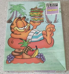 Puzzle piscina vintage Rainbow Works Garfield 100 pz con panino frutta - Foto 1 di 6