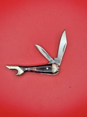 NUEVA NAVAJA DE BOLSILLO IMPERIAL SCHRADE DAMAS PIERNA ROJA ÁMBAR EN FORMA DE BOTA ABREBOTELLAS Foto 1 de 3