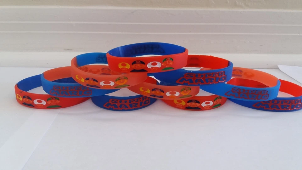 BRILLA EN LA OSCURIDAD - Pulseras Super Mario niños fiesta cumpleaños favores Foto 1 de 1