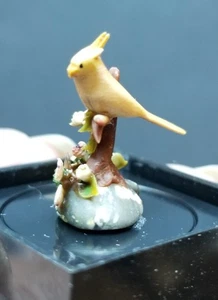 DOLLHOUSE MINIATURE  ARTISAN HAND SCULPTED YELLOW BIRD FIGURINE ON FLORAL BASE - Picture 1 of 4