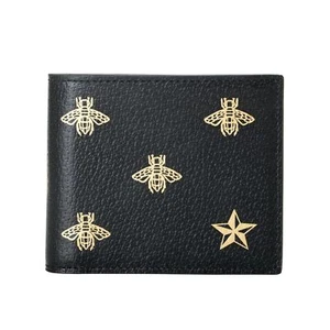 Cartera plegable de cuero texturizado con estampado de estrellas de abeja negra y dorada Gucci para hombre - Imagen 1 de 4