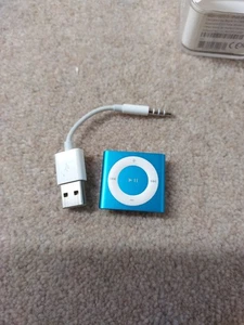 Apple iPod Shuffle MP3 Player- Model A1373. 2GB.  Blue. In Packaging  - Picture 1 of 9