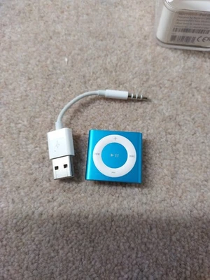 Apple iPod Shuffle MP3 Player- Model A1373. 2GB.  Blue. In Packaging  - Image 1 of 4