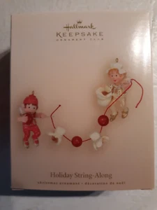Hallmark Andenken Ornament Holiday String-Along 2007 - Bild 1 von 1