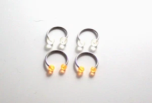 2 Paar 16g 1/2 UV Glow Clear Pink Gitter Hufeisen Brustwarze Nase Schlange beißen sexy - Bild 1 von 3