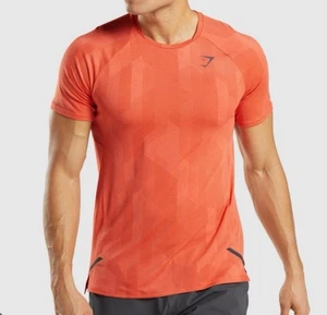 Camiseta Gymshark para hombre talla mediana naranja Apex sin costuras manga corta elástica gimnasio - Imagen 1 de 10