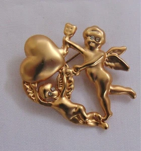 Broche prendedor vintage de ángeles en tono dorado con un corazón ojos de estrás nuevo - Imagen 1 de 3