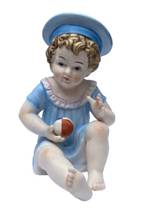 German Bisque Porcelain Piano Baby Wearing Blue Sailor Cap Holding Toy Ball - Picture 1 of 8