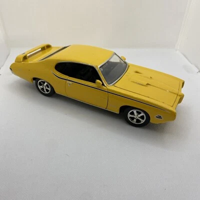 1969 Pontiac GTO Judge Yellow 1:18 Diecast Model Car - Image 1 of 4