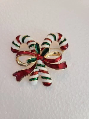 Broche de cristal esmaltado con lazo de caña de caramelo doble navidad festivo tono dorado monet Foto 1 de 4