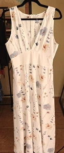 Vestido midi floral blanco vibrante, diseño de cintura alta sin mangas y elegante - Imagen 1 de 5